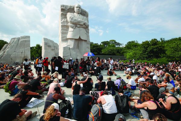 Demonstrators protest, at the Martin Luther King Jr Memorial in Washington, on 6 June 2020 over the death of George Floyd